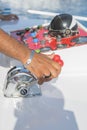 Captain at the helm yacht. Men`s hand drives a yacht. concept of sea recreation and tourism. vertical photo