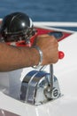 Captain at the helm yacht. Men`s hand drives a yacht. concept of sea recreation and tourism. vertical photo