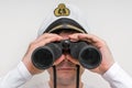 Captain looks through a binoculars Royalty Free Stock Photo