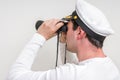 Captain looks through a binoculars Royalty Free Stock Photo