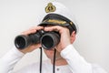 Captain looks through a binoculars Royalty Free Stock Photo