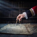 The captain of the old ship paves the course with the help of vintage maps and nautical divider. Old discovery, explorer, history Royalty Free Stock Photo