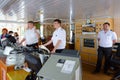 Captain of river cruise ship Alexander Benois and captain`s assistants in captain`s cabin