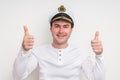 Captain with sailor cap showing two thumbs up Royalty Free Stock Photo