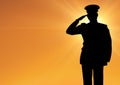 Captain silhouette saluting against sun Royalty Free Stock Photo