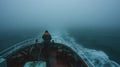 The captain skillfully navigates the ship through a dense fog relying on years of experience to guide the vessel safely
