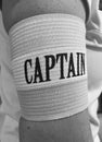 Captain of the soccer team wearing a sports band with the word captain displayed on the arm