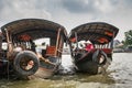 Captains prepare their tourist boats in Cai Be, Mekong Delta, Vietnam