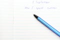 Caption ballpoint pen in a school notebook Royalty Free Stock Photo