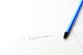 Caption ballpoint pen in a school notebook Royalty Free Stock Photo