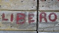Caption Libero on old wooden door Royalty Free Stock Photo