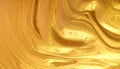 Luxurious golden liquid texture abstract background with shimmering fluid waves Royalty Free Stock Photo