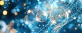 Abstract image of transparent bubbles with golden particles on a blue background symbolizing scientific innovation and