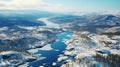 Captivating aerial view of snow covered pine trees in norwegian winter forest drone shot