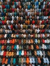 Aerial view of the crowd of Muslim people attending a religious ceremony.