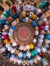 Aerial view of the crowd of Muslim people attending a religious ceremony.