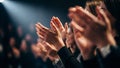 Captivating applause fills a dimly lit auditorium highlighting shared celebration and support for Royalty Free Stock Photo