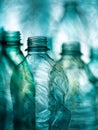 Transparent plastic bottles with intricate texture and subtle lighting effects creating an abstract and artistic composition in Royalty Free Stock Photo