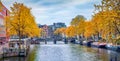 Captivating autumn scene of Amsterdam city. Famous Dutch channels and great cityscape. Panoramic morning view of Netherlands, Euro