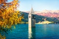 Captivating autumn view of  bell tower of Curon Venosta church rising out of the waters lake of Resia, Graun im Vinschgau village Royalty Free Stock Photo