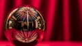 Festive Fireworks Reflected in a Glass Sphere on Red Royalty Free Stock Photo