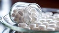 Close up of white pills spilling out of pill bottle on blurred background Royalty Free Stock Photo