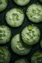 Cucumber slices with water droplets. On the table in close-up. Royalty Free Stock Photo