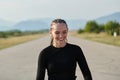 Focused Stride: Close-Up Capture of Intensely Running Athlete.