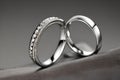 Captivating close up shot of two wedding rings, delicately intertwined to symbolize the everlasting bond of love and commitment. Royalty Free Stock Photo