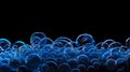 Cluster of sci-fi bath foam bubbles with neon blue highlights against a black background, creating a mesmerizing and futuristic Royalty Free Stock Photo