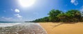 Captivating deserted beachscape with a radiant sun in a clear sky in Ghana, Africa