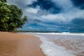 Captivating deserted beachscape with a radiant sun in a clear sky in Ghana, Africa