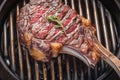 Captivating detail Grilled beef tomahawk steak, a close up culinary spectacle Royalty Free Stock Photo