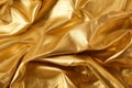 Captivating golden crumpled foil texture background with an alluring and mesmerizing appeal. Royalty Free Stock Photo