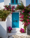 Captivating Greek House with White Walls, Blue Accents, and Blooming Pink Flowers