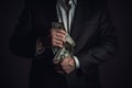 Businessman holding money in his hands, close-up on dark background Ai Generative Royalty Free Stock Photo