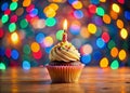 Festive 33rd Birthday Celebration A Vibrant Cupcake Illuminated by Night Lights and a Flickering Candle Captured in Royalty Free Stock Photo
