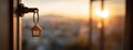 House Key with Keychain at Sunset Royalty Free Stock Photo