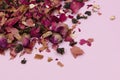 Herbal tea with rose petals on pink background. Copy space. Royalty Free Stock Photo
