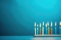 A captivating image of a group of lit candles creating a warm and inviting atmosphere on a table, Happy birthday candles are