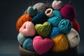 Colorful knitting yarn balls in a basket on dark background with copy space