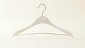 A Detailed Look at a Miniature White Coat Hanger Tilted Perspective and Exquisite Detail Royalty Free Stock Photo