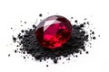 Exquisite Deep Red Ruby Gemstone Sparkling on a Textured Black Powder Bed A Stunning Visual Display of Gemological Royalty Free Stock Photo
