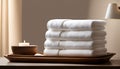 A captivating image showcasing a well-organized stack of luxurious, clean white towels resting Royalty Free Stock Photo