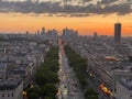 A beautiful shot of a bright orange sunset sky over the skyline of Paris, France