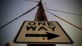 Following the Arrow of Singular Direction of a One Way Sign Royalty Free Stock Photo