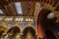 A captivating interior view of a synagogue showcasing its ornate ceiling with geometric patterns, arched windows Royalty Free Stock Photo