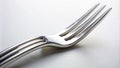 Closeup View of a Silver Kitchen Fork Detailed Texture and Design Against a Clean White Background Ideal for Royalty Free Stock Photo