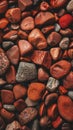 A captivating mosaic of polished jasper stones in a variety of rich, crimson tones, their intricate patterns and