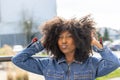 Joyful African American Woman in Denim Jacket Making a Kissy Face Outdoors Royalty Free Stock Photo